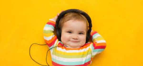 Happy child listening to music after finding a solution. 