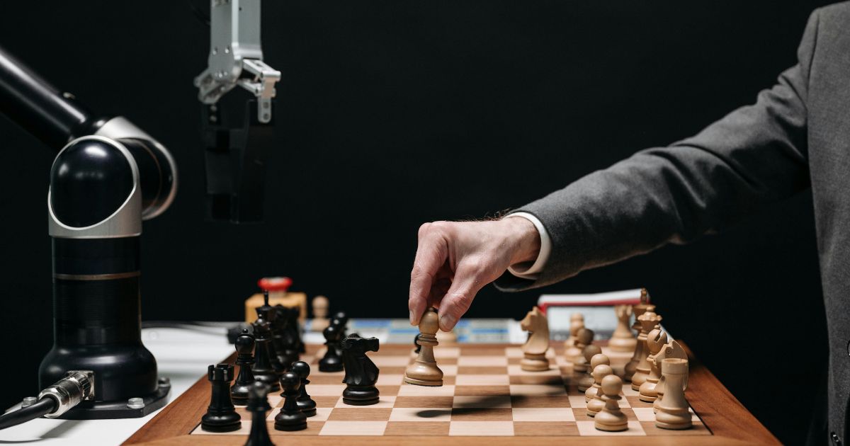 An image of a AI robot playing chess with human representing Proactive Stance in a Rapidly Evolving Landscape: Adapting with Confidence 
